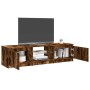 Mueble de TV con luces LED roble ahumado 140x40x35,5 cm